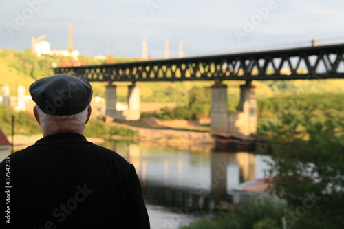man admiring the future river bridge