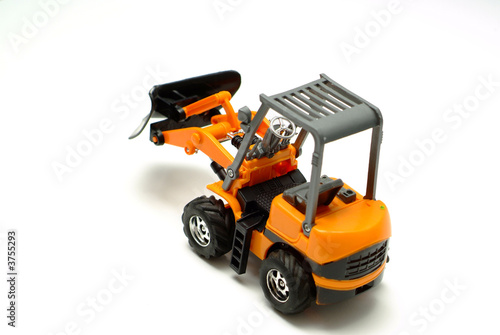 Small model bulldozer on white