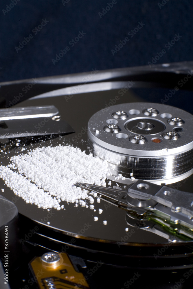 Hard Disk Drive with a white powdery substance on it. Hard Disk Drive with a white powdery substance on it.