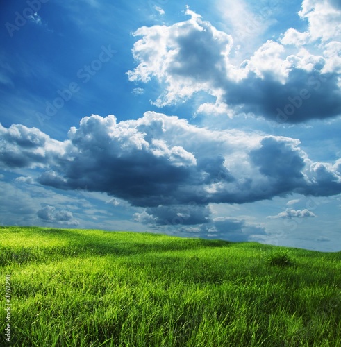 Field and storm clouds photo