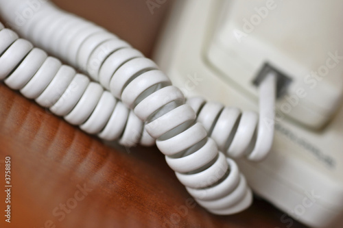 modern telephone, waiting for it to ring with that call.