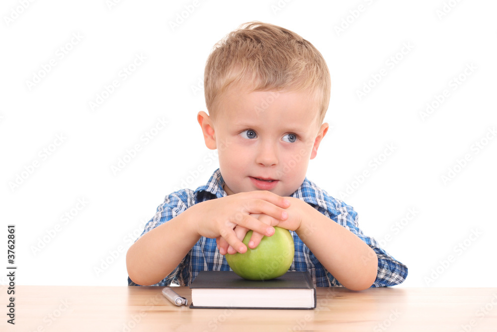 Fototapeta premium 3 years old at desk isolated on white