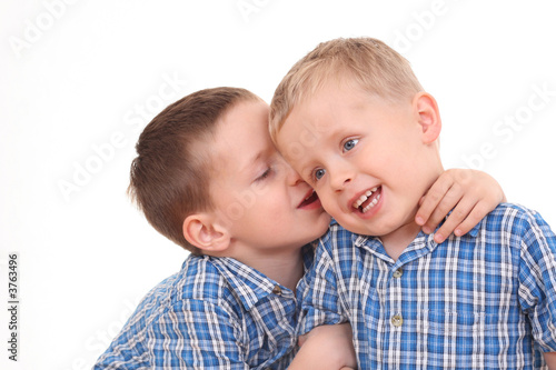 two boys and their little secrets isolated on white