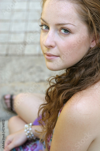 Pretty girl sitting on the stairs