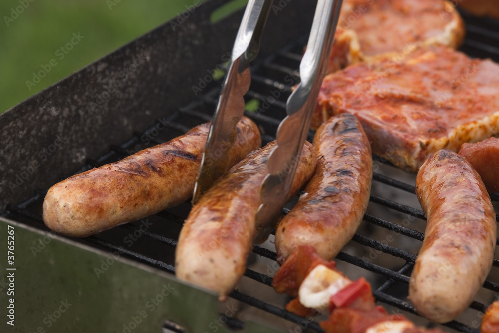 sausages and chops on the barbecue sausages and chops on the barbecue