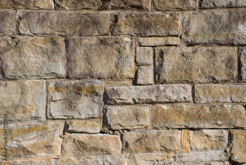 an old stone wall made from huge blocks of sandstone