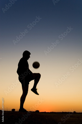 Fototapeta Naklejka Na Ścianę i Meble -  football at sunset
