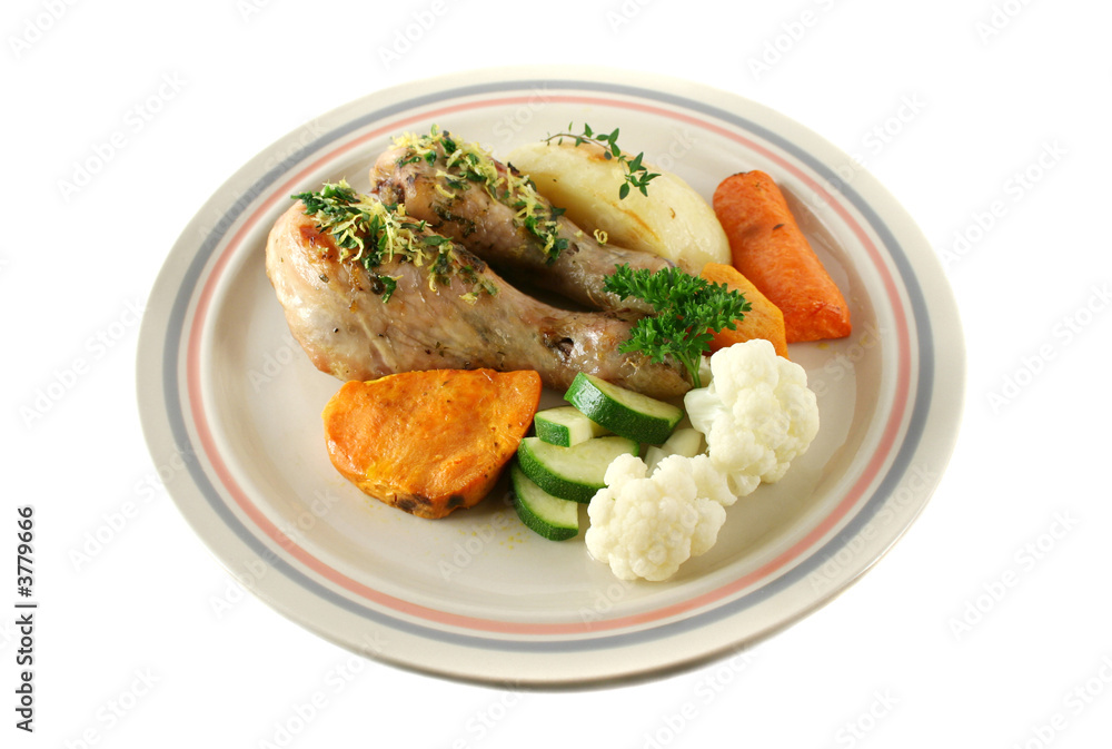 Delicious roasted chicken drumsticks with baked vegetables. Delicious roasted chicken drumsticks with baked vegetables.