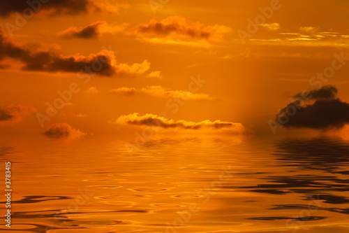 beautiful orange sky reflected in the water