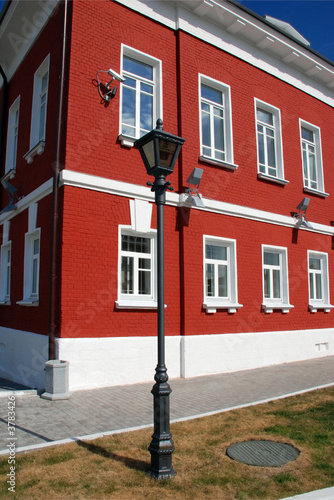 street lamp in front of red house