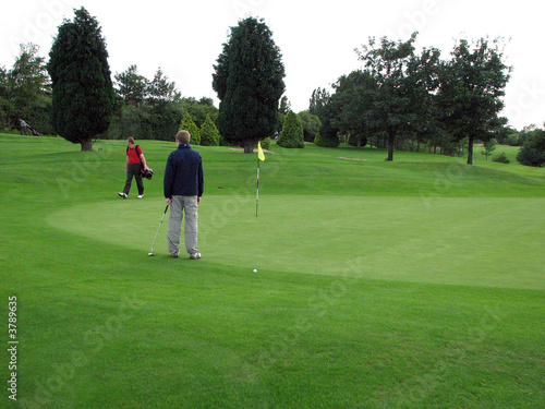 Golfers Pausing