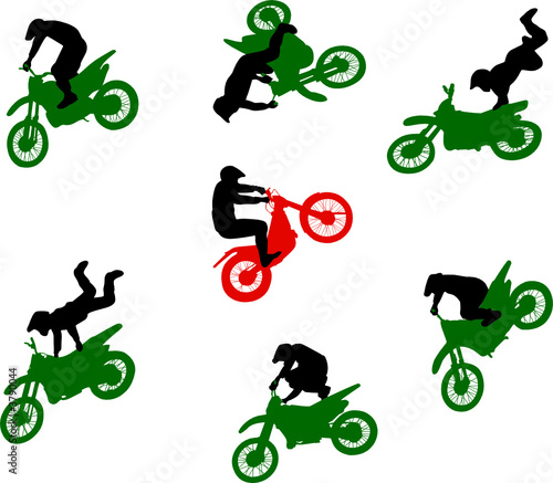 Silhouettes of stuntmen on motorcycles in flight.