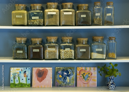 Spice jars on kitchen shelf