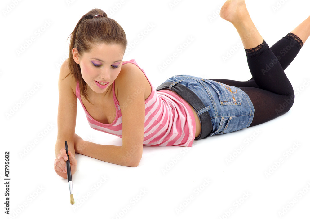 beautiful girl painting / write on a floor. white background. beautiful girl painting / write on a floor. white background.