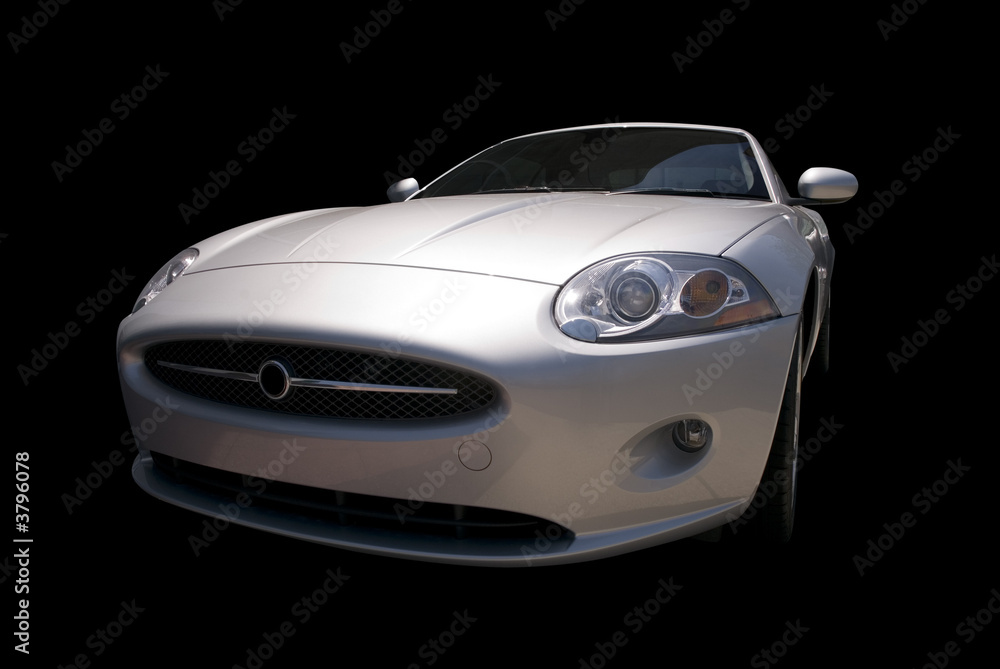 Modern  sports car with classic styling. Isolated on a black. 