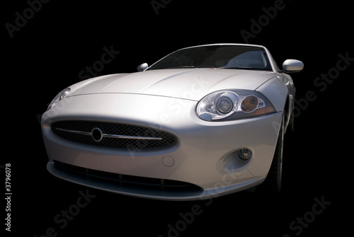 Modern  sports car with classic styling. Isolated on a black.  © Michael Shake