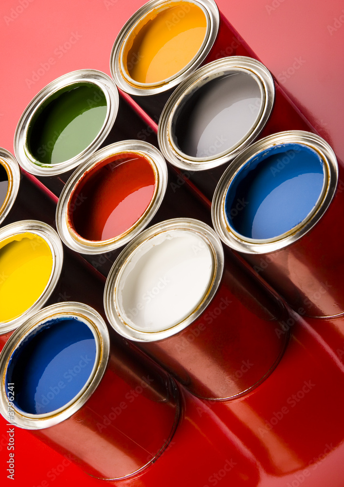 colorful cans on the red background colorful cans on the red background