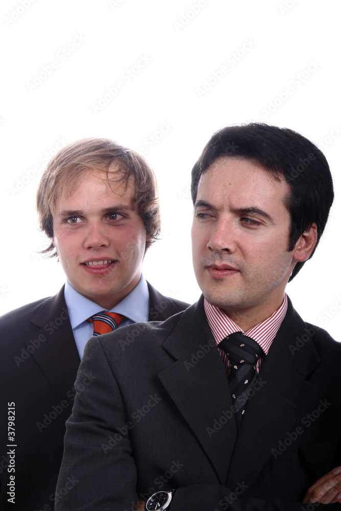 two young business men portrait on white. focus on the right man two young business men portrait on white. focus on the right man