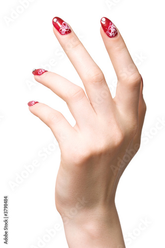 Woman hand with red decorated nails. Isolated on white.