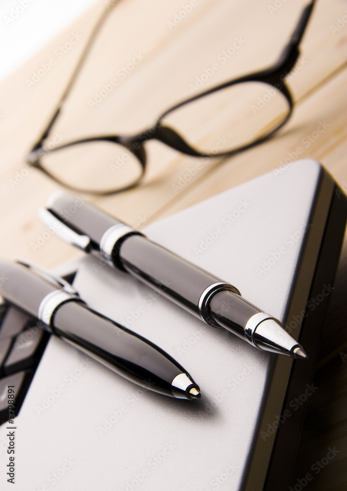 Fototapeta premium pens, notebook and glasses