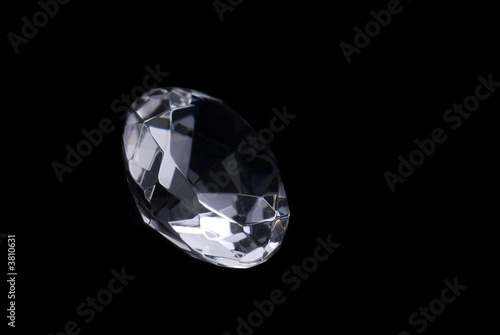 Close up of a cut diamond on black background