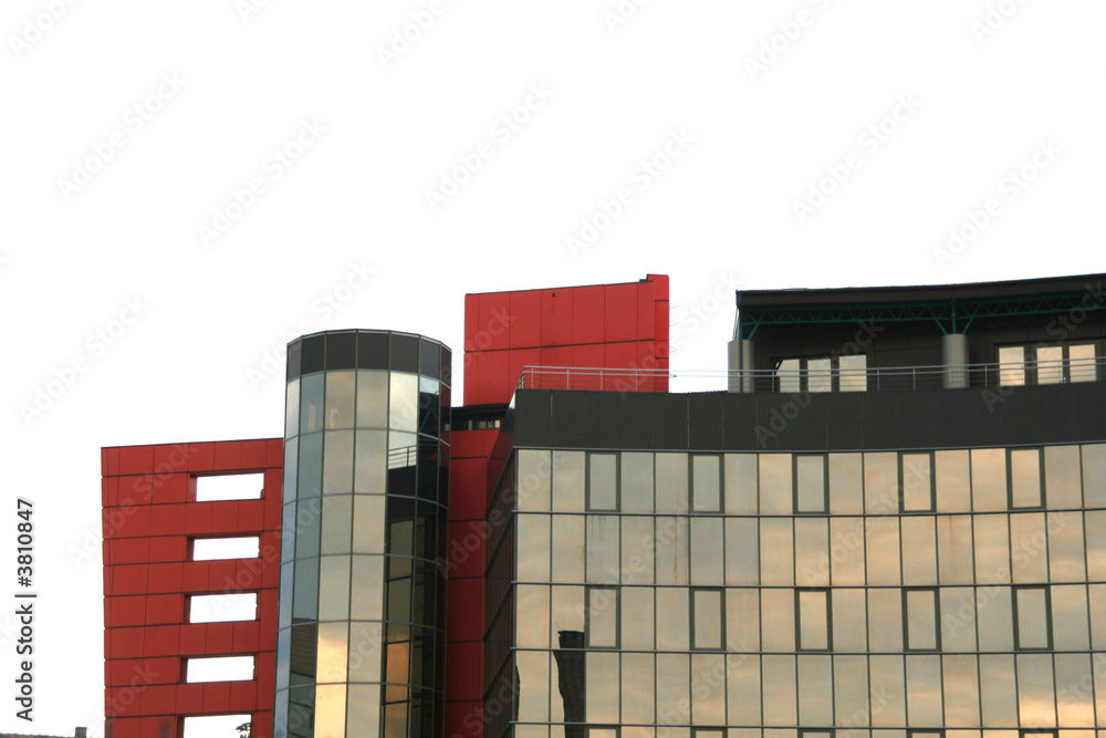 modern glass building along the blue sky with clouds modern glass building along the blue sky with clouds