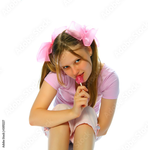 фотографія teenager with sugarplum isolated on white background