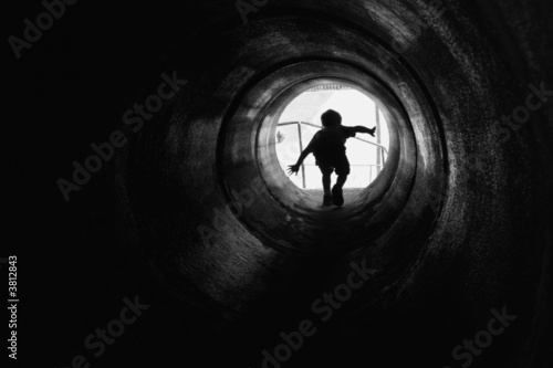 Boy Running in a Tunnel