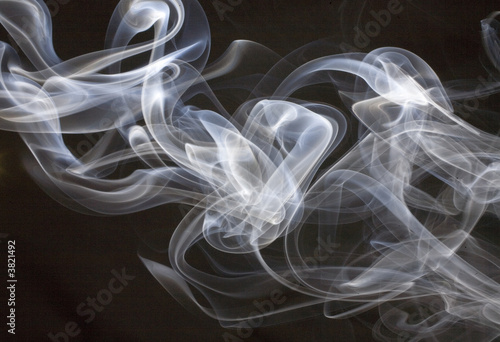 White smoke billowing on a black background