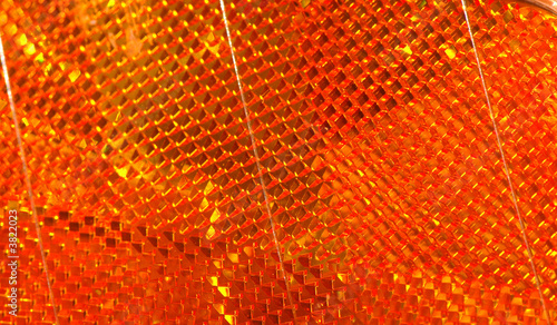 Macro view of the orange reflector on a car photo