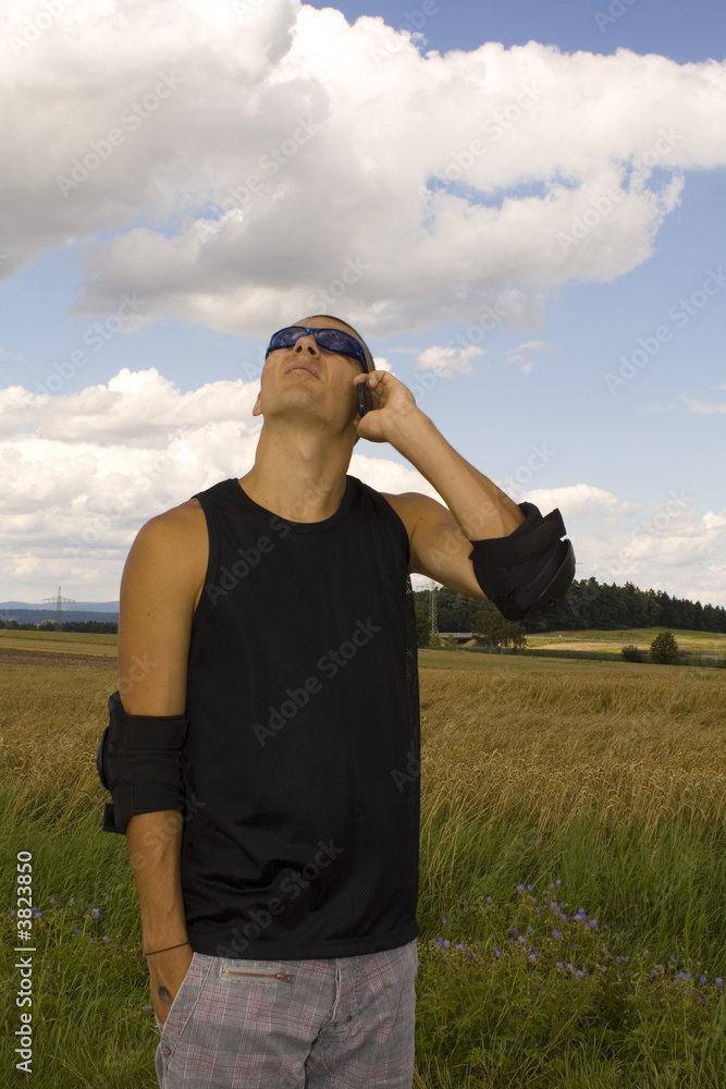 a young man on rollerblades is calling a young man on rollerblades is calling