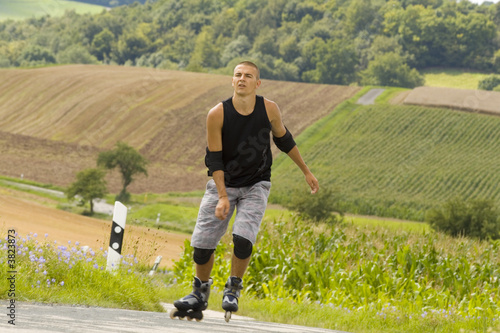 Plakat a young man on rollerblades #1