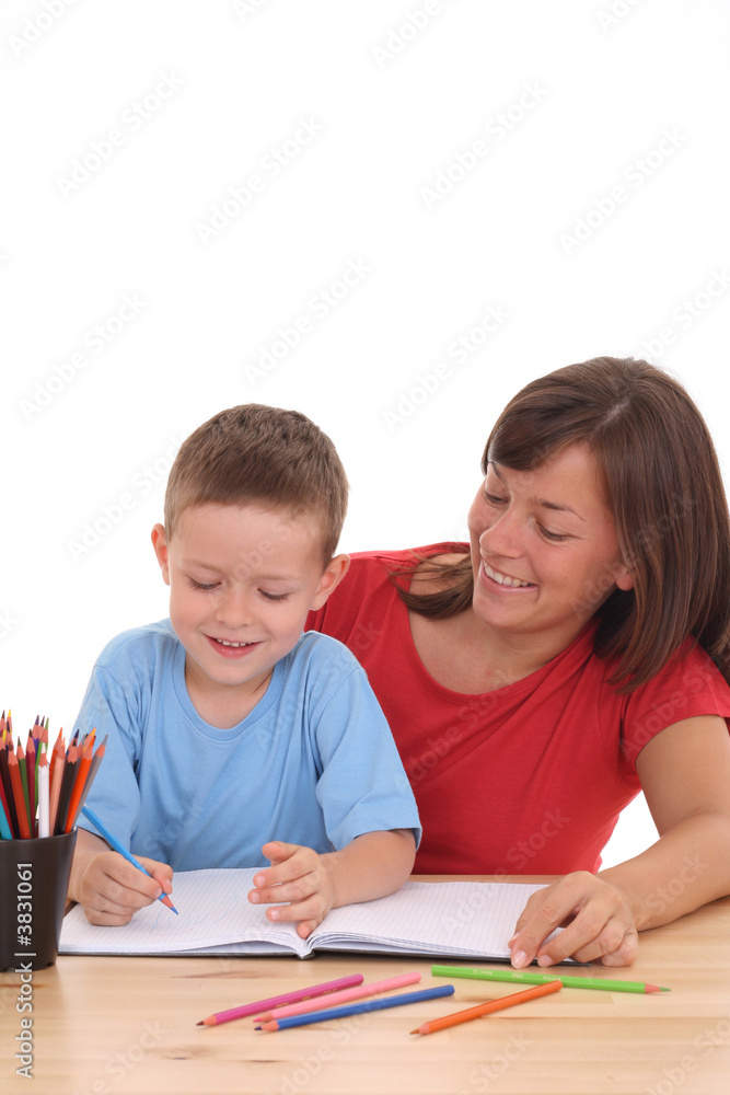 mother and 5 years old son drawing together isolated mother and 5 years old son drawing together isolated