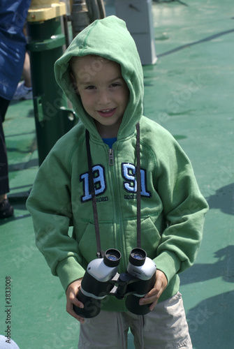 a young boy with binoculars