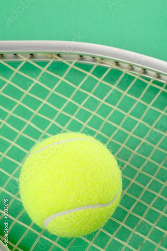 a tennis ball and racket