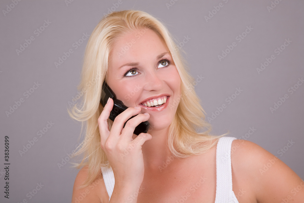 Beautiful blond woman with a big smile talking Beautiful blond woman with a big smile talking