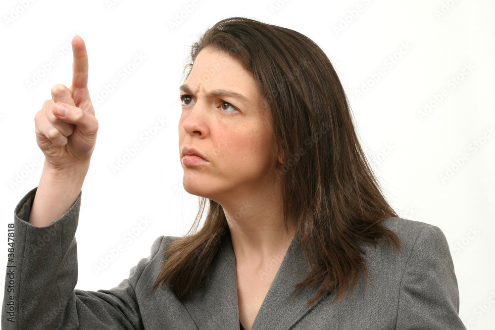 Frowning business woman with pointing finger Frowning business woman with pointing finger