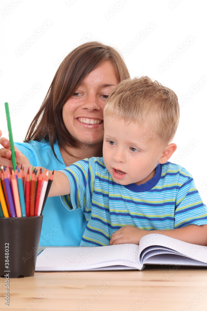 mother and 3-4 years old son drawing together isolated mother and 3-4 years old son drawing together isolated