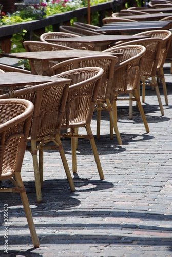 Tables and chairs at street cafe