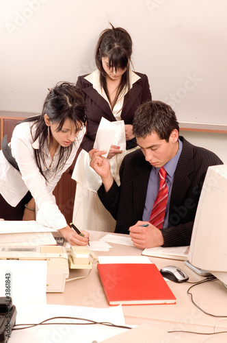 Businessman in his office at table working with computer photo