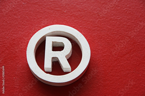 Registered trademark in a red background photo