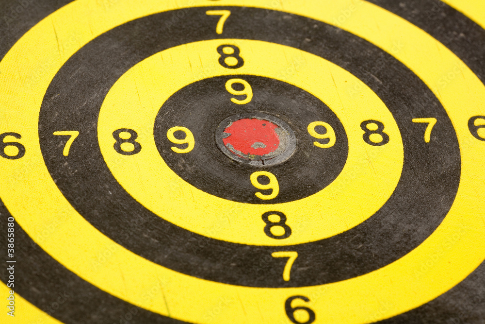 a dartboard close up shot a dartboard close up shot