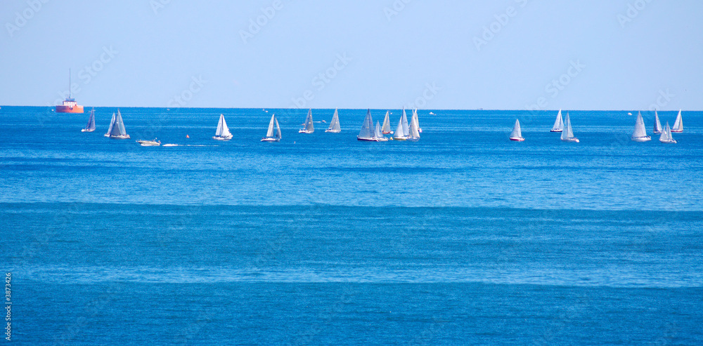 Cluster of racing sailboats on a Great Lake