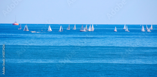Cluster of racing sailboats on a Great Lake