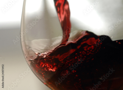 closeup of pouring red wine