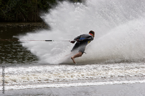 A barefoot waterskier going backwards