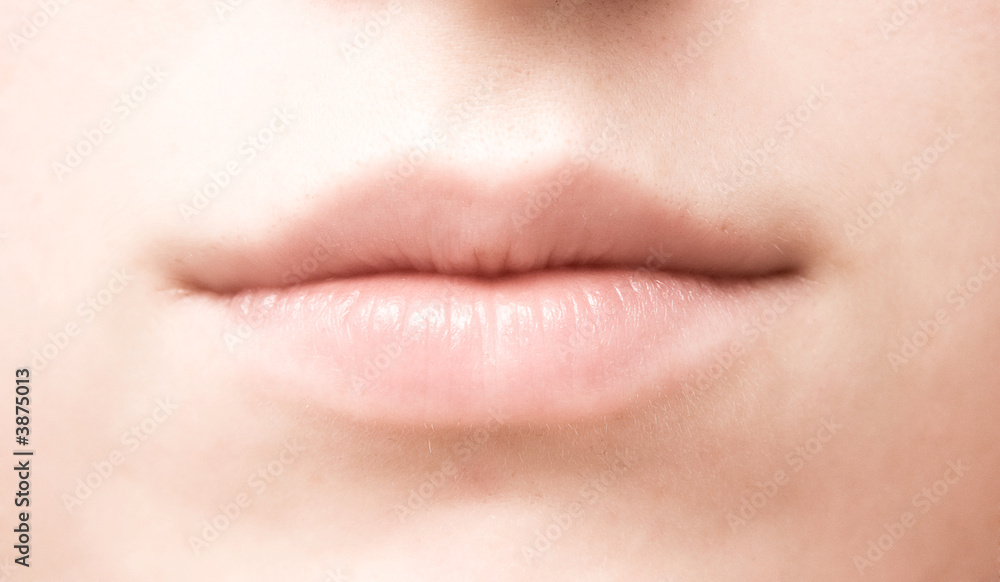 Woman mouth closeup. Soft colors.
