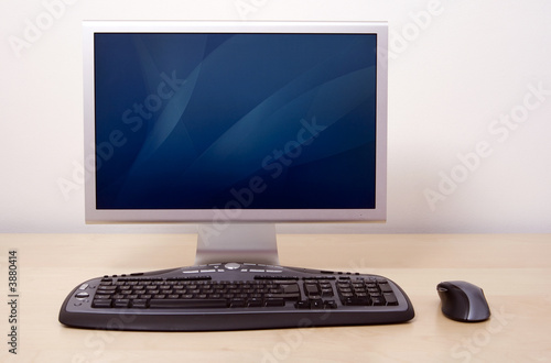 Computer in office with keyboard and mouse. Switch on.