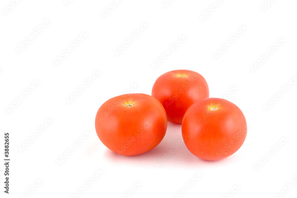 3 red tomatoes on a white background