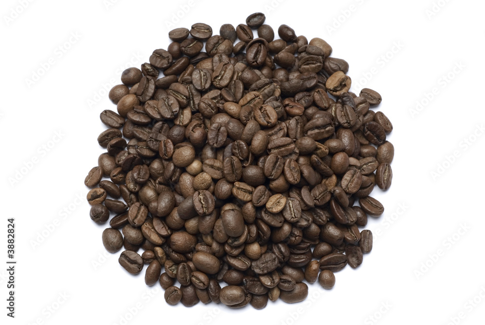 Coffee beans spilled onto a white background Coffee beans spilled onto a white background